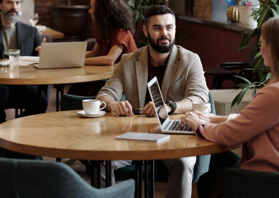 Man on laptop in bar